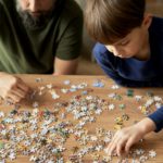 Top view of solving jigsaw puzzle on the table